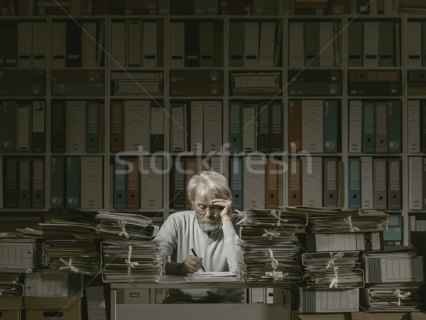 Overloaded senior office worker Stock photo © stokkete