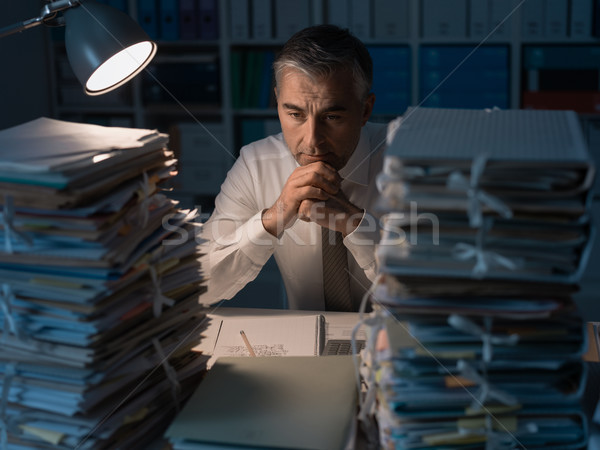 Business executive overloaded with work Stock photo © stokkete
