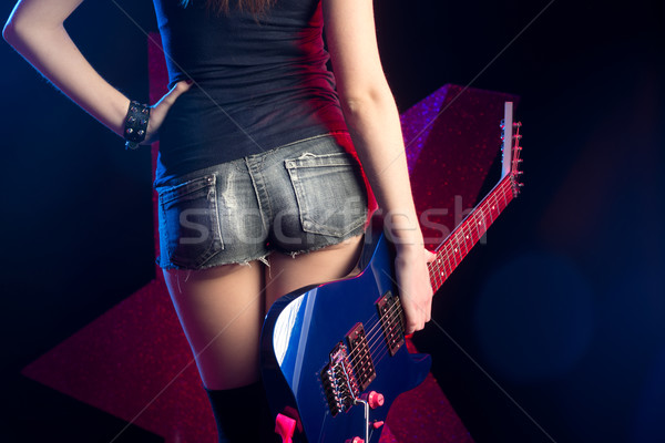 Rocksztár lány gitár elektromos gitár hátulnézet szexi Stock fotó © stokkete