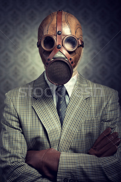 Vintage businessman wearing gas mask Stock photo © stokkete