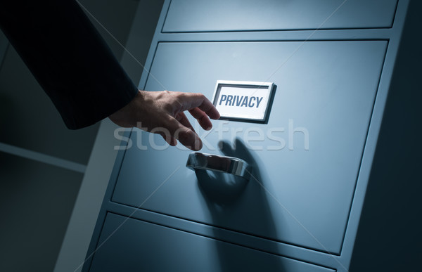 Office worker searching confidential information Stock photo © stokkete