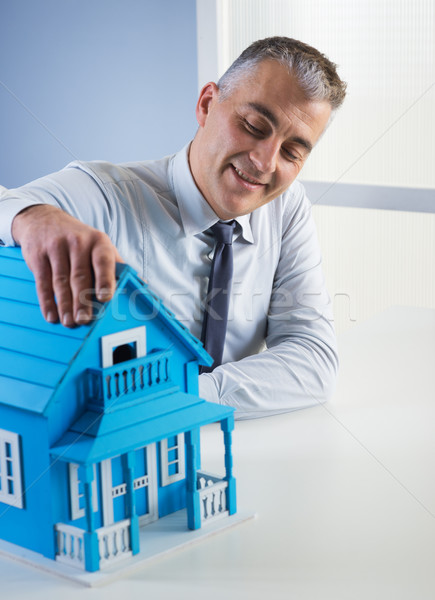 Real estate agent with model house Stock photo © stokkete