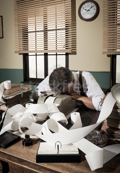 Tired overworked accountant in office, 1950s style Stock photo © stokkete
