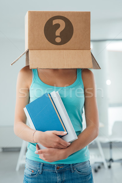 Insecure female student with a box on her head Stock photo © stokkete
