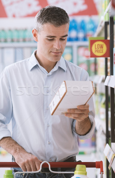 Man reading food labels Stock photo © stokkete