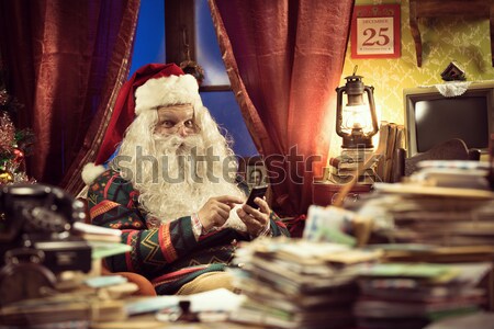 Santa Claus relaxing at home Stock photo © stokkete