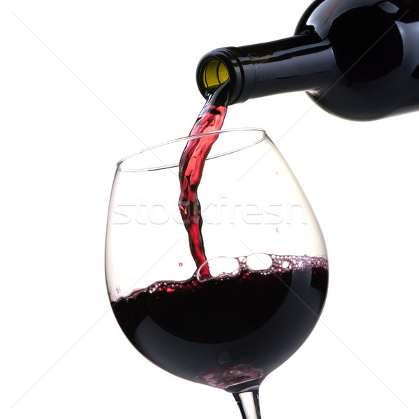 Pouring red wine into a wineglass Stock photo © stokkete