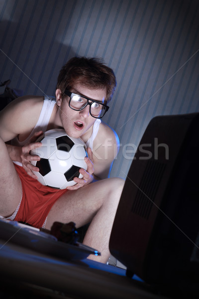 Soccer Fan Watching Television Stock photo © stokkete