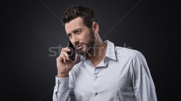 Young businessman having a phone call Stock photo © stokkete