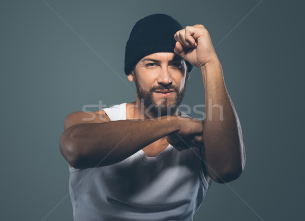 Cool stylish rapper gesturing Stock photo © stokkete