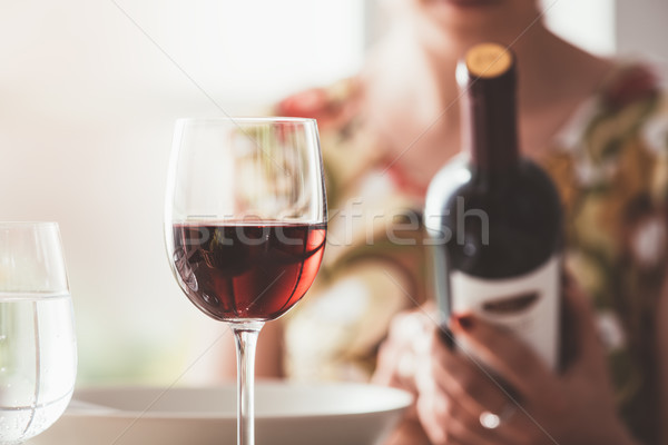 Woman reading a wine label Stock photo © stokkete