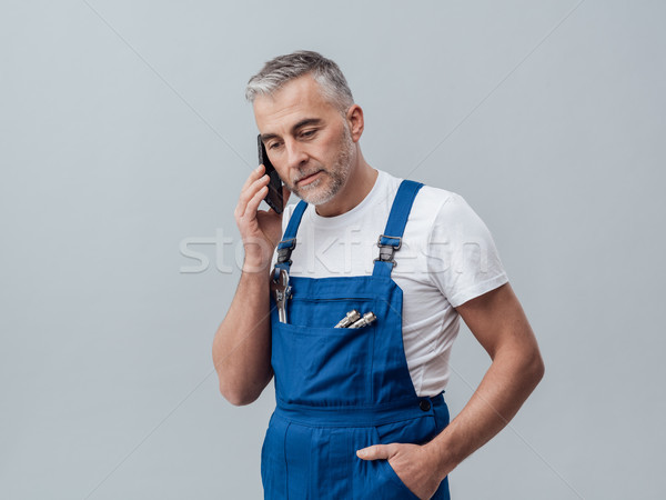 Repairman on the phone Stock photo © stokkete