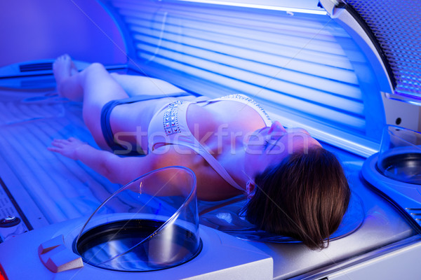 Woman on tanning bed Stock photo © stokkete