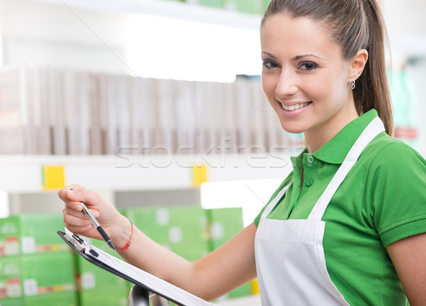 Stock photo: Supermarket worker with clipboard