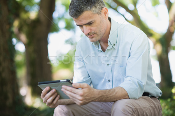 Man connecting with a tablet Stock photo © stokkete