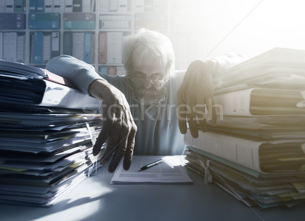 Stressed overloaded office worker Stock photo © stokkete