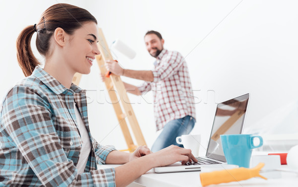 Happy couple remodeling their house Stock photo © stokkete