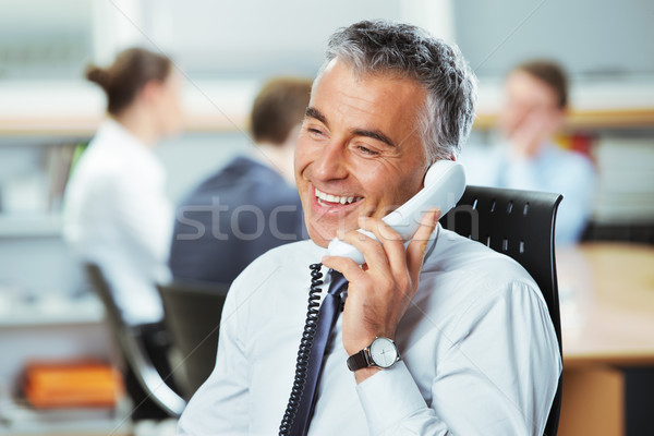 добрая весть зрелый бизнесмен телефон коллеги человека Сток-фото © stokkete