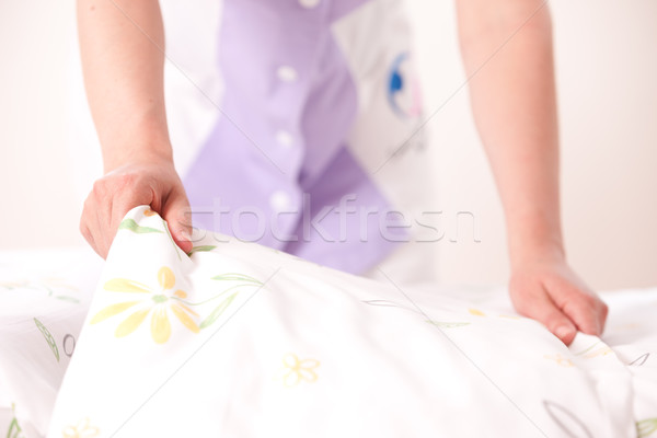 Woman making bed Stock photo © stokkete