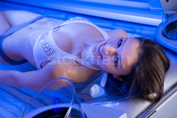 Woman on tanning bed Stock photo © stokkete