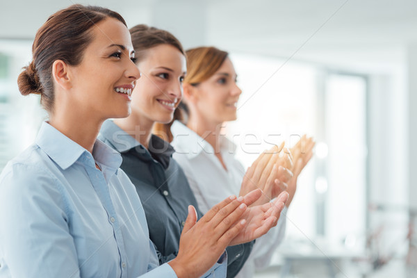 Cheerful business women applauding Stock photo © stokkete