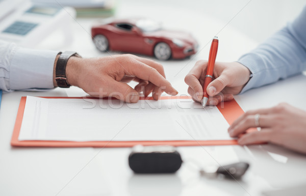 Driver signing a car insurance Stock photo © stokkete