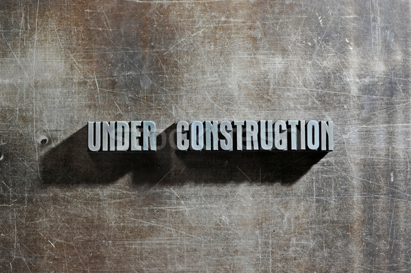 Image of a Under Construction sign with a metallic background te Stock photo © stokkete