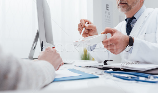 Doctor giving a prescription medicine Stock photo © stokkete