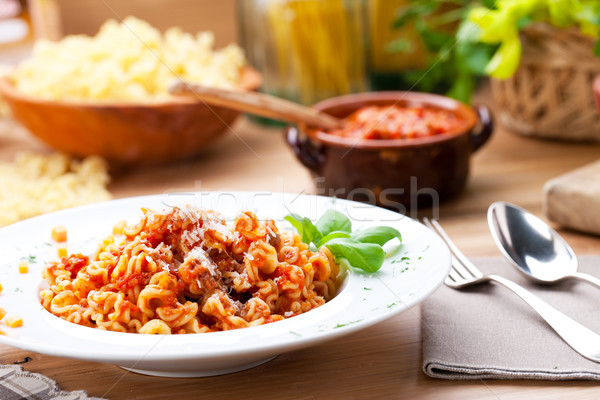 Macarrão molho de tomate comida italiana queijo parmesão comida jantar Foto stock © stokkete