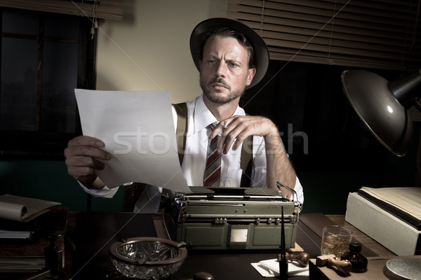 Stock photo: Professional reporter proofreading his text