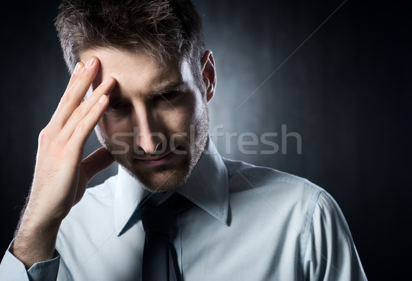 Kopfschmerzen erschöpft jungen Geschäftsmann anfassen Kopf Stock foto © stokkete