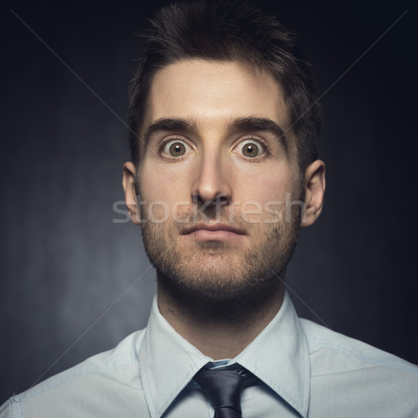 Confused surprised man Stock photo © stokkete