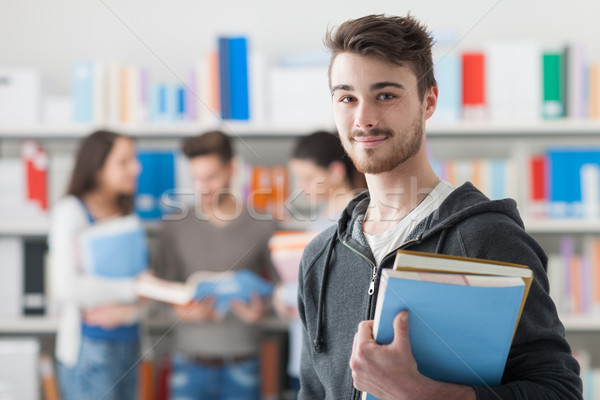 Stockfoto: Student · poseren · bibliotheek · knap · boeken