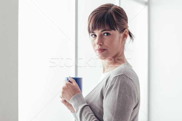 Woman having an hot coffee Stock photo © stokkete