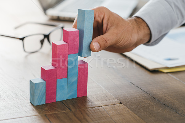 Businessman building a successful financial graph Stock photo © stokkete