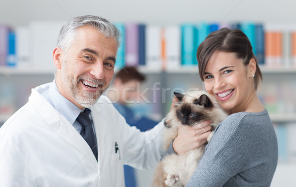A woman with her cat at the veterinary clinic Stock photo © stokkete