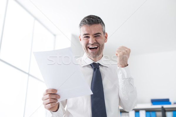 Cheerful businessman receiving good news Stock photo © stokkete