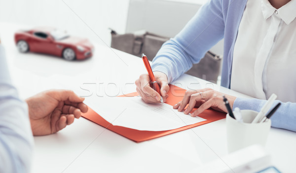 Driver signing a car insurance Stock photo © stokkete