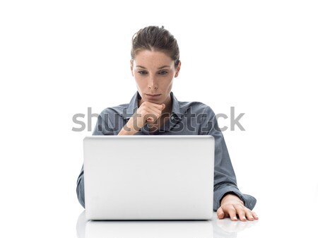 Businesswoman working with a laptop Stock photo © stokkete