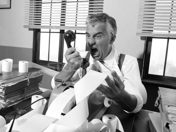 Angry vintage businessman shouting at phone Stock photo © stokkete