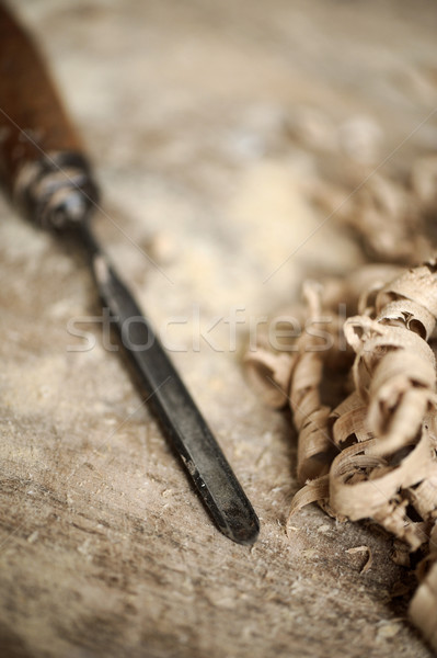 a work table of a carpenter with a gouge and a pile of wood chip Stock photo © stokkete