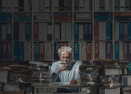 Overloaded senior office worker Stock photo © stokkete