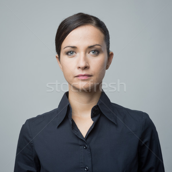 Serious woman in blue shirt Stock photo © stokkete