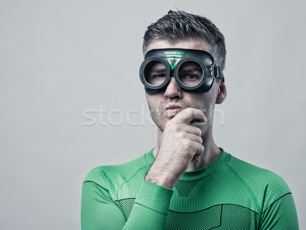 Zamyślony superhero strony podbródek funny patrząc Zdjęcia stock © stokkete