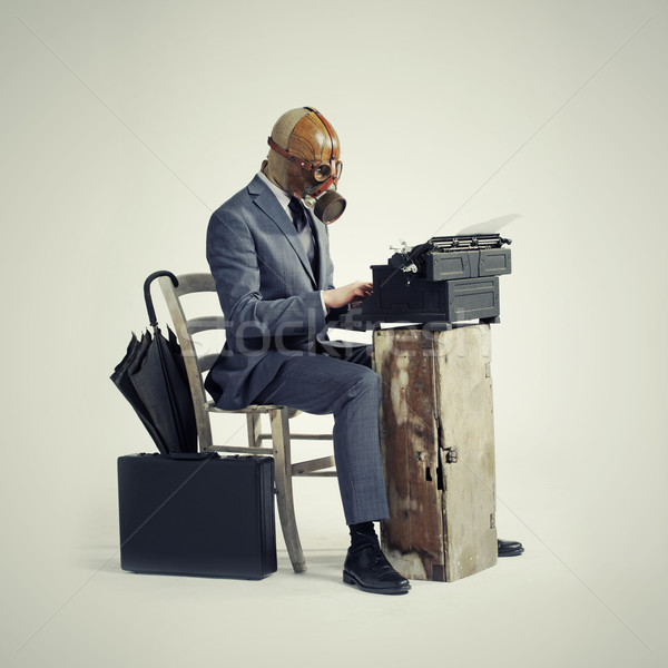 business wearing a gas mask, write with an old typewriter Stock photo © stokkete