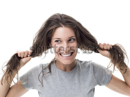 Angry woman having a bad hair day Stock photo © stokkete