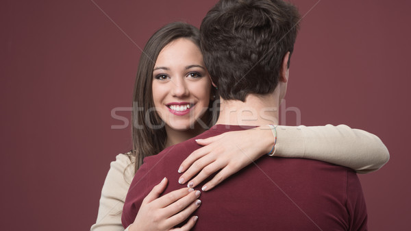 Stock photo: Smiling girl with her boyfriend
