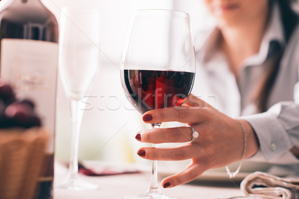 Woman tasting wine and having lunch Stock photo © stokkete