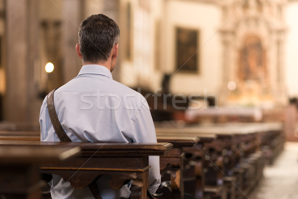 Homem sessão igreja meditando fé religião Foto stock © stokkete
