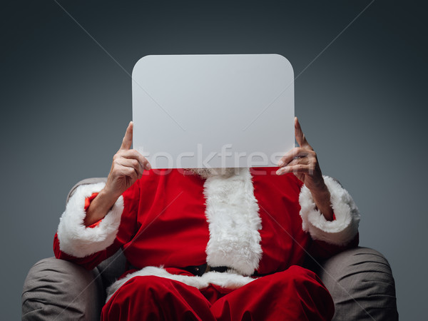Santa Claus holding a sign Stock photo © stokkete